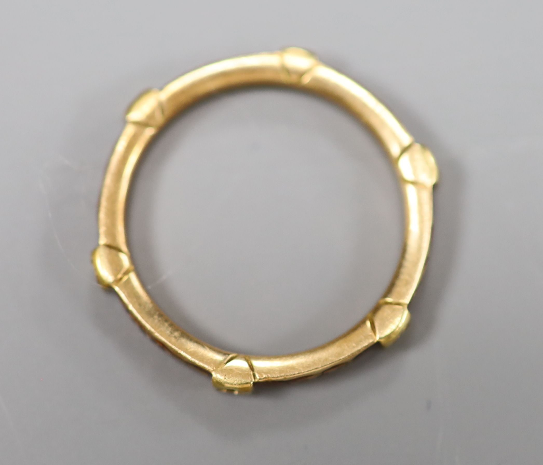 A French yellow metal and red enamel hexagonal band, inscribed Je Pense a Vous Tou Jours, (pearls? missing), size J,